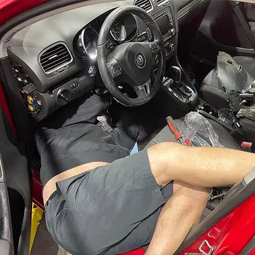 Steering & Suspension in Blowing Rock, NC. Image of an auto car expert lying under the steering, repairing it